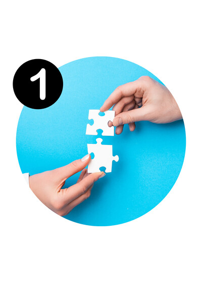 hands holding puzzle pieces